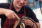 Helen Reader working on a bridle